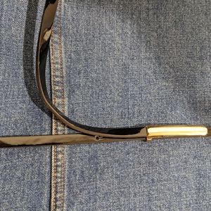 Women's 40 in length thin black high gloss belt gold buckle